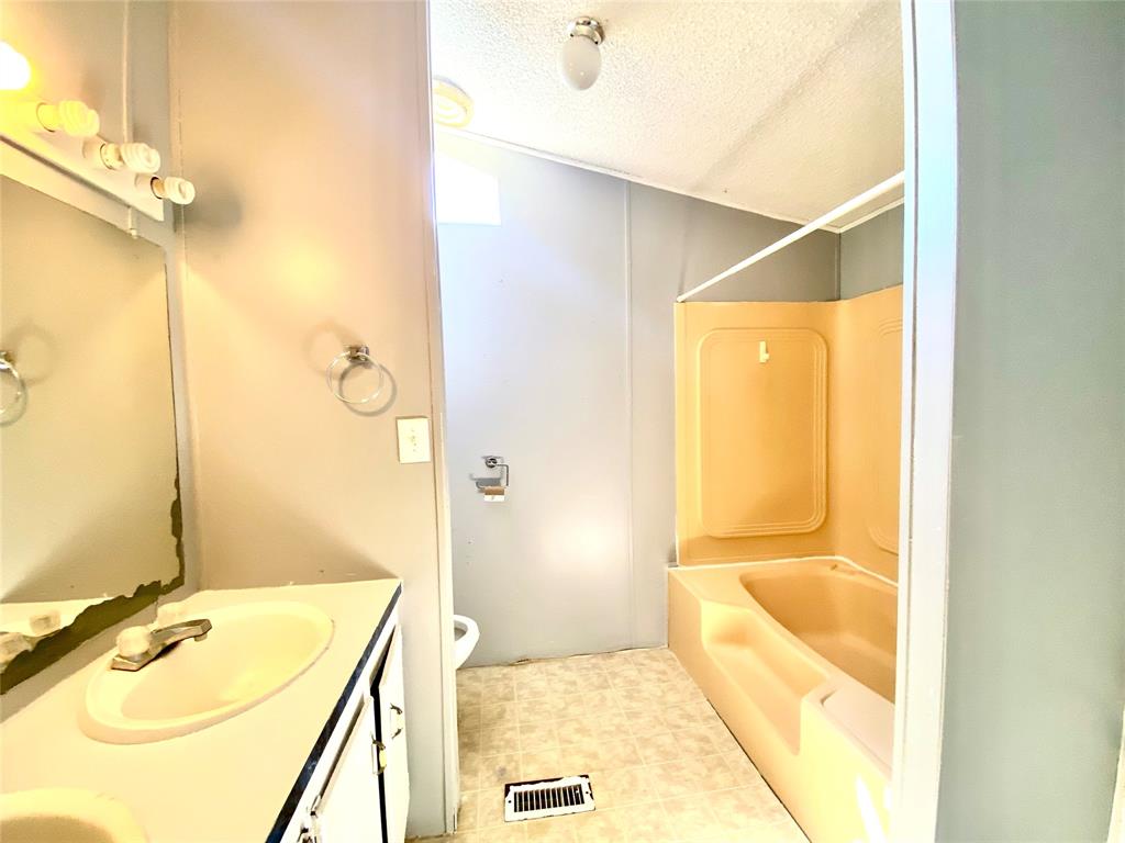 100 South Beltline Road, Unit 79 Dallas, TX 75253 - Photo 10 of 15 a bathroom with a tub sink and shower