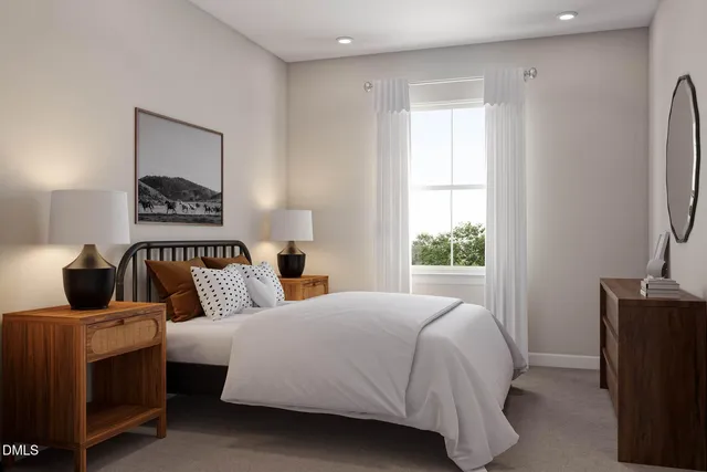 a bedroom with bed and window