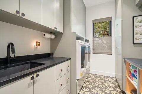 a view of a refrigerator a sink and dishwasher with wooden floor