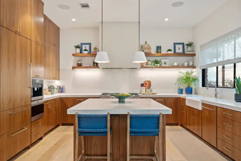 a kitchen with a sink stove and cabinets