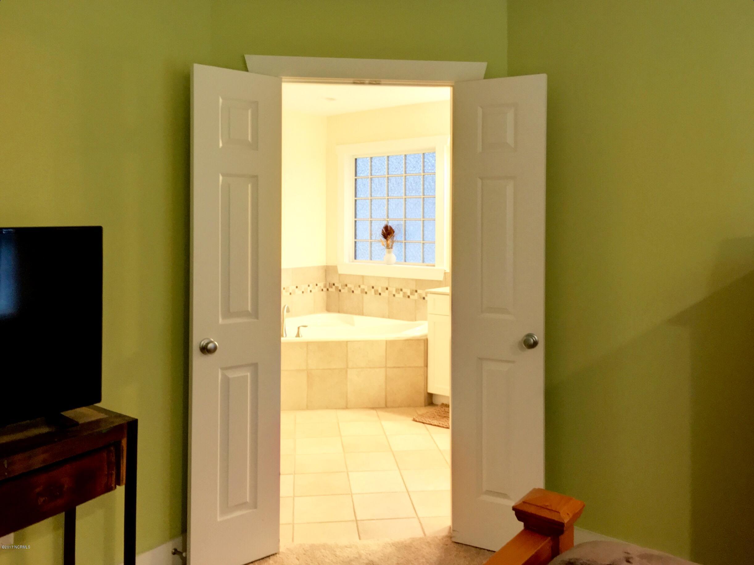 1007 Cordgrass Road Hampstead, NC 28443 - Photo 17 of 31 Master Bedroom to Bathroom