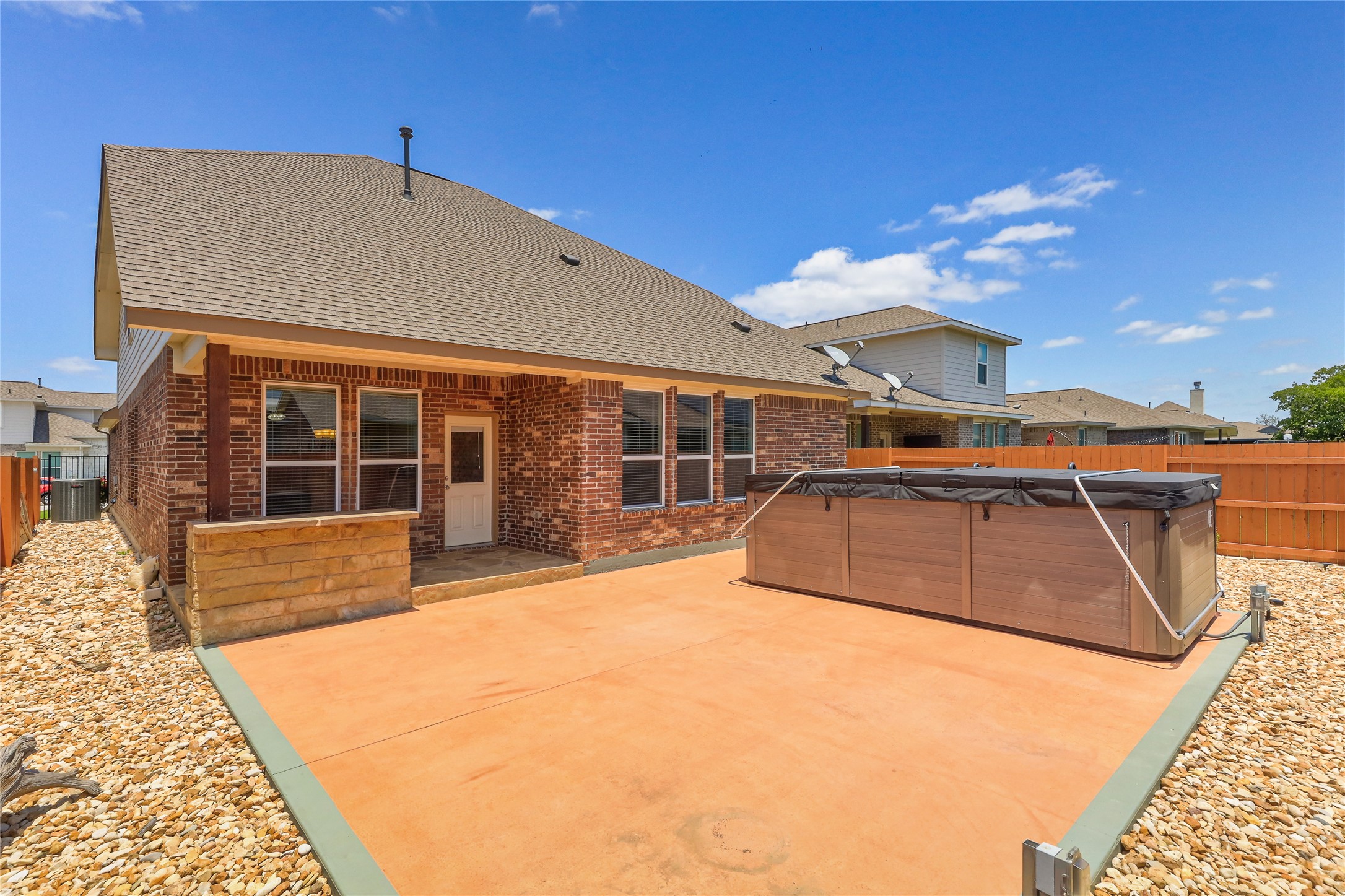 205 Penna Lane Georgetown, TX 78628 - Photo 28 of 32 A private backyard oasis features a spacious patio area, ideal for outdoor relaxation and entertainment.