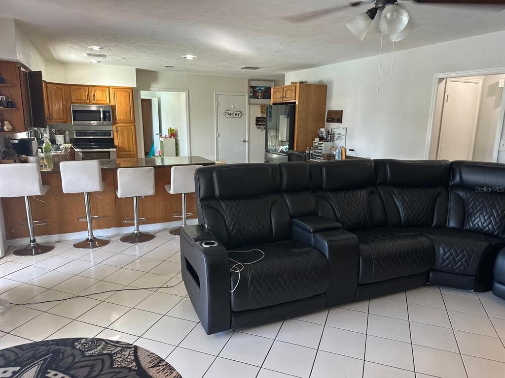 613 Royal Crest Way Brandon, FL 33511 - Photo 17 of 50 a living room with furniture and kitchen view
