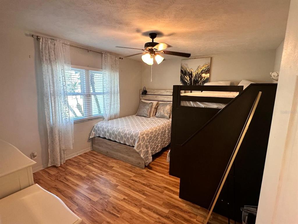 613 Royal Crest Way Brandon, FL 33511 - Photo 18 of 50 a bedroom with a bed and a chandelier