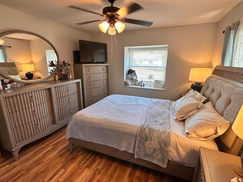 613 Royal Crest Way Brandon, FL 33511 - Photo 2 of 50 a bedroom with a bed and a mirror on the dresser