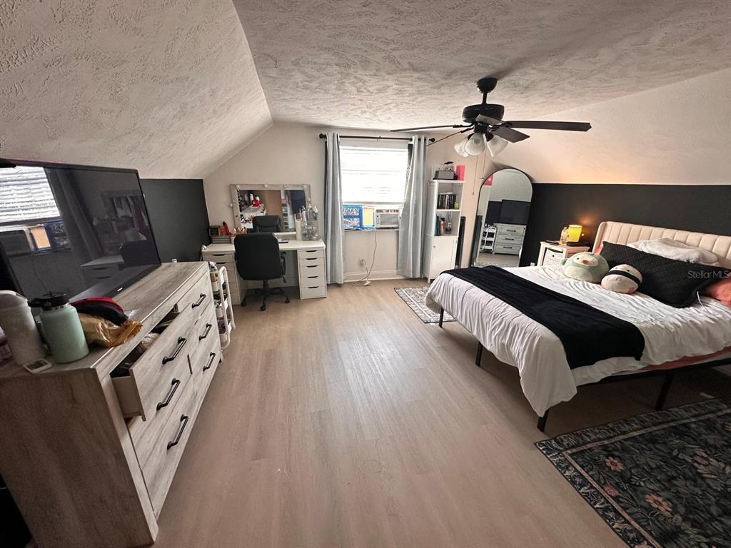 613 Royal Crest Way Brandon, FL 33511 - Photo 27 of 50 a bedroom with furniture and a fireplace