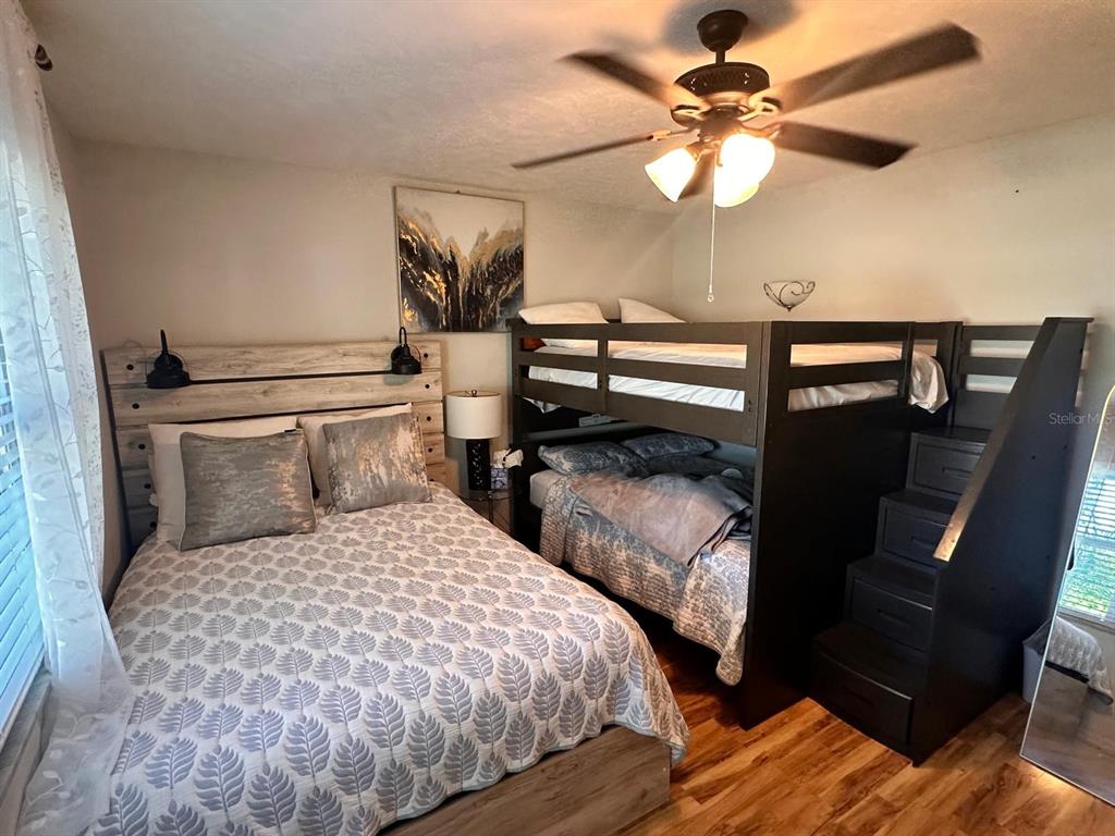 613 Royal Crest Way Brandon, FL 33511 - Photo 32 of 50 a bedroom with a bed and a chandelier