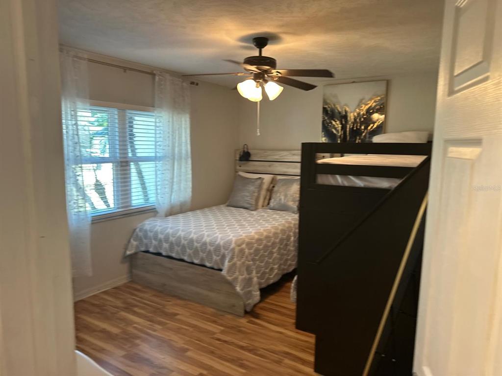 613 Royal Crest Way Brandon, FL 33511 - Photo 43 of 50 a bedroom with a bed and a chandelier