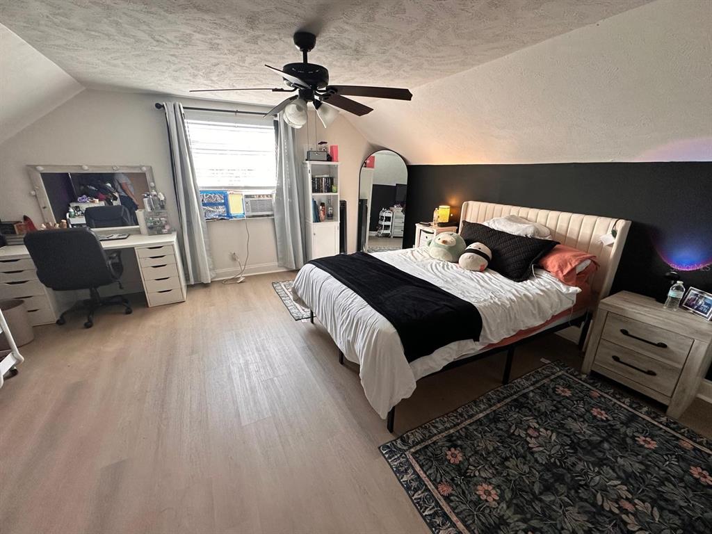 613 Royal Crest Way Brandon, FL 33511 - Photo 45 of 50 a bedroom with a bed and wooden floor