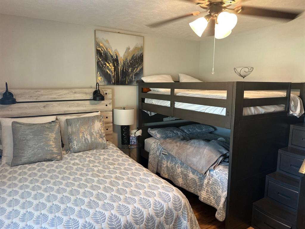613 Royal Crest Way Brandon, FL 33511 - Photo 7 of 50 a bedroom with double bed and a chandelier