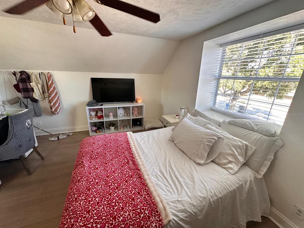 613 Royal Crest Way Brandon, FL 33511 - Photo 8 of 50 a bedroom with a bed and a flat screen tv