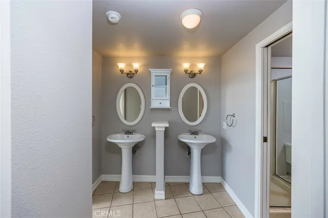 a bathroom with a toilet and a mirror