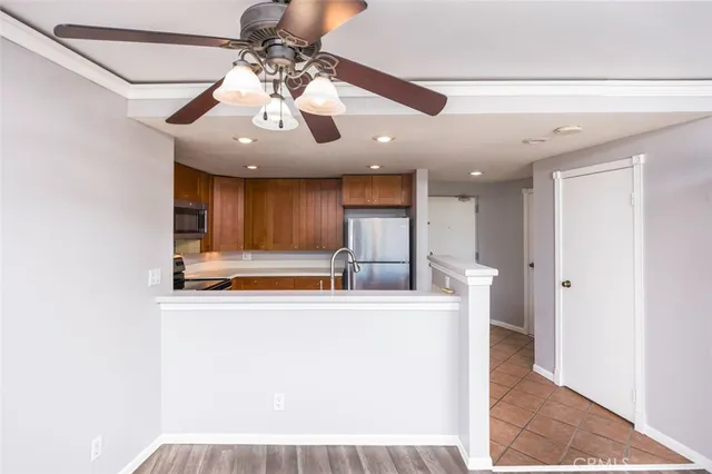 a view of a kitchen with a sink and cabinet