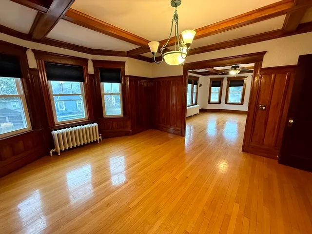 a view of hall way with furniture and staircase