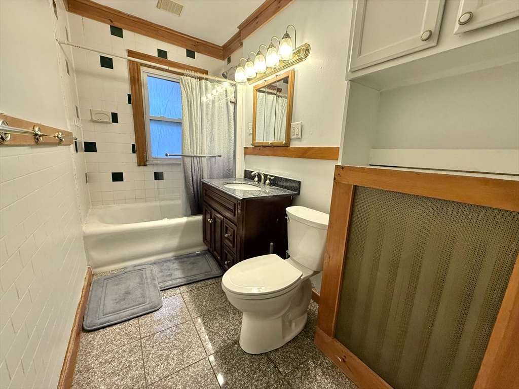 4 Adams Avenue, Unit 2 Watertown, MA 02472 - Photo 14 of 32 a bathroom with a sink toilet and shower