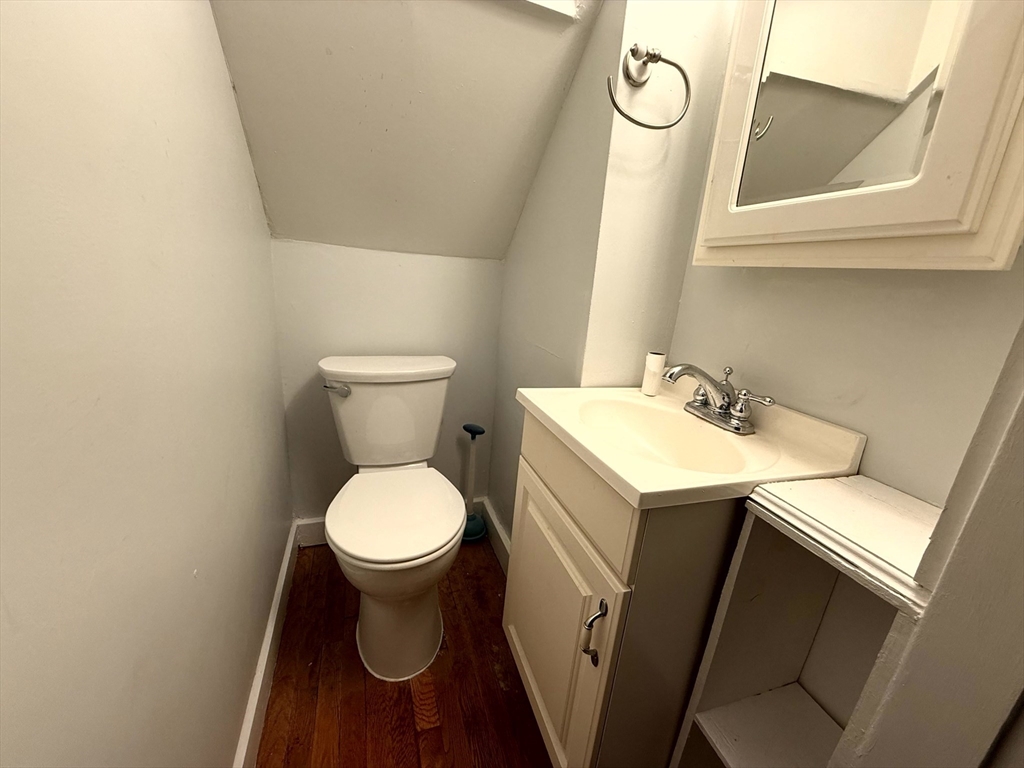 4 Adams Avenue, Unit 2 Watertown, MA 02472 - Photo 17 of 32 a bathroom with a toilet sink and mirror