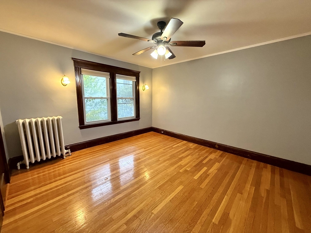4 Adams Avenue, Unit 2 Watertown, MA 02472 - Photo 20 of 32 wooden floor in an empty room with a window