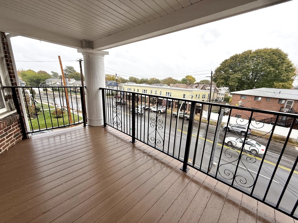 4 Adams Avenue, Unit 2 Watertown, MA 02472 - Photo 25 of 32 a view of balcony with wooden floor
