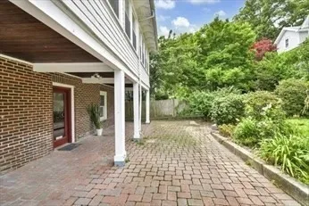 a bedroom with a bed and a mirror