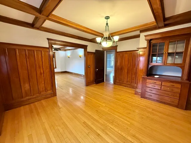 a view of a room with wooden floor