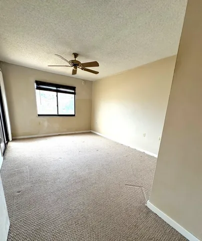 a view of an empty room with windows