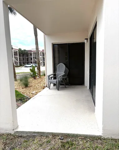 a view of backyard with a patio and outdoor seating