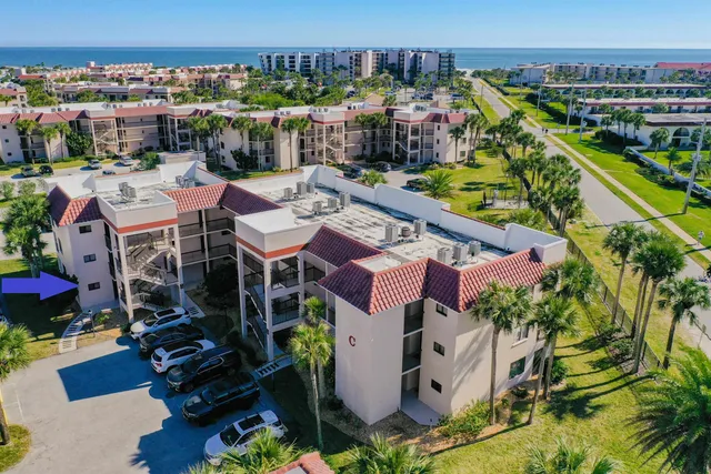 a kitchen with a sink a stove and a microwave