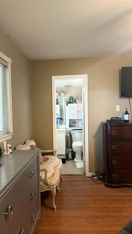 a bathroom with a bathtub and a window