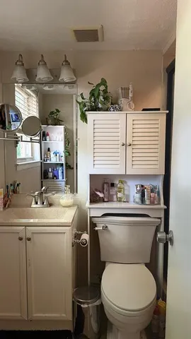 a bedroom with a bed and a ceiling fan