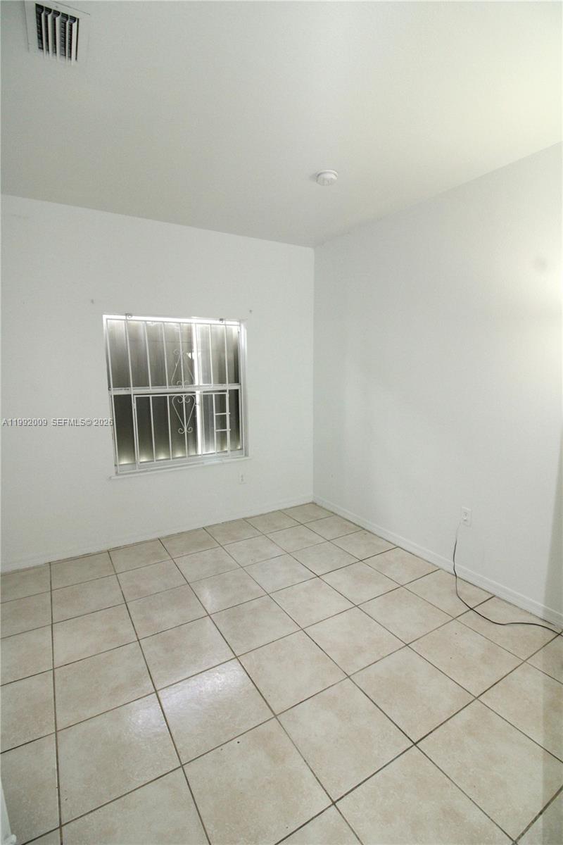 13929 Southwest 282nd Street Homestead, FL 33033 - Photo 15 of 30 a view of an empty room with windows