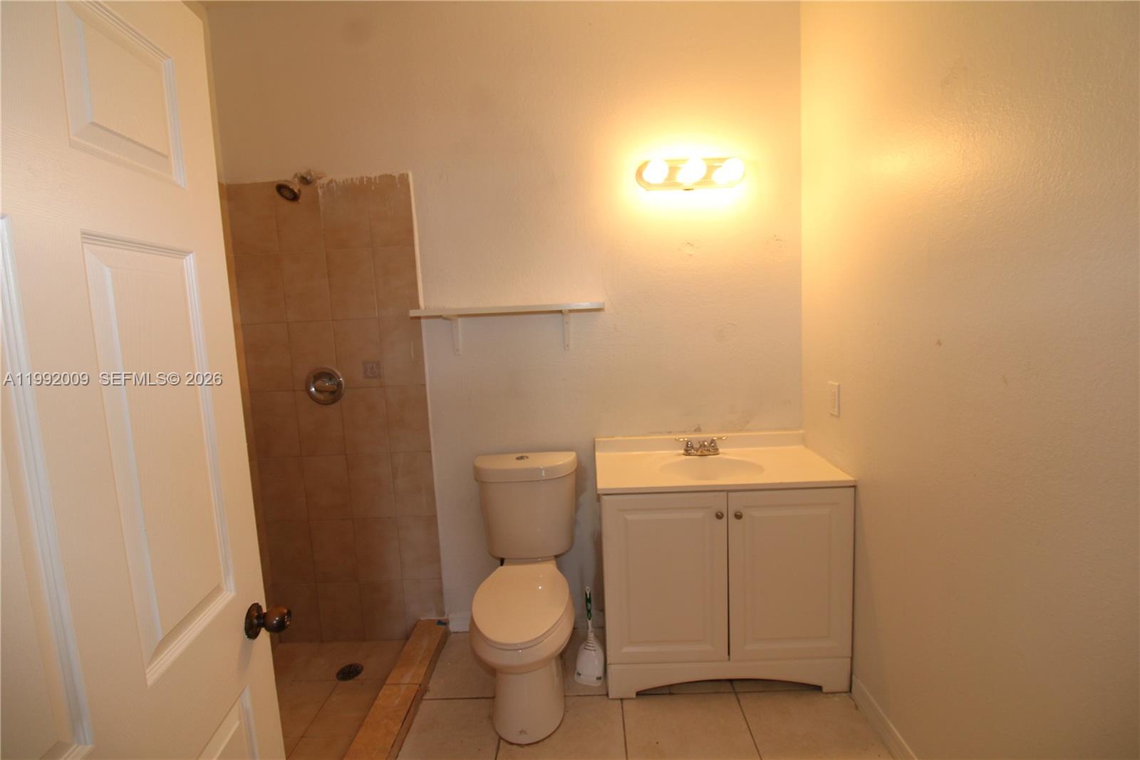 13929 Southwest 282nd Street Homestead, FL 33033 - Photo 20 of 30 a bathroom with a sink a toilet and shower