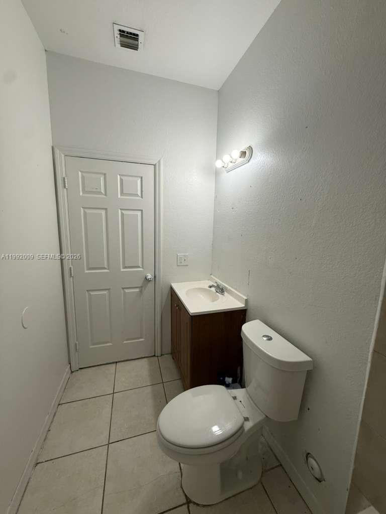 13929 Southwest 282nd Street Homestead, FL 33033 - Photo 24 of 30 a bathroom with a toilet sink and shower