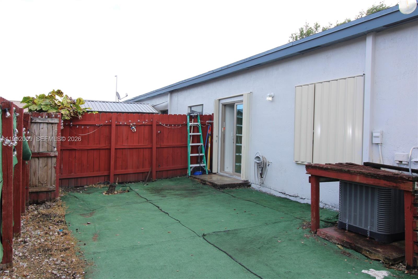 13929 Southwest 282nd Street Homestead, FL 33033 - Photo 25 of 30 a view of backyard with deck and entertaining space