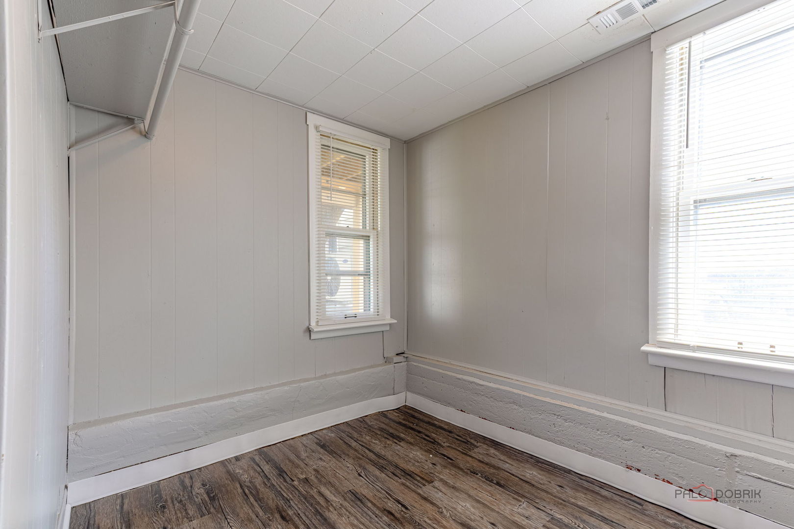 163 Eagle Point Road, Unit 1 Fox Lake, IL 60020 - Photo 13 of 26 a view of an empty room with wooden floor and a window