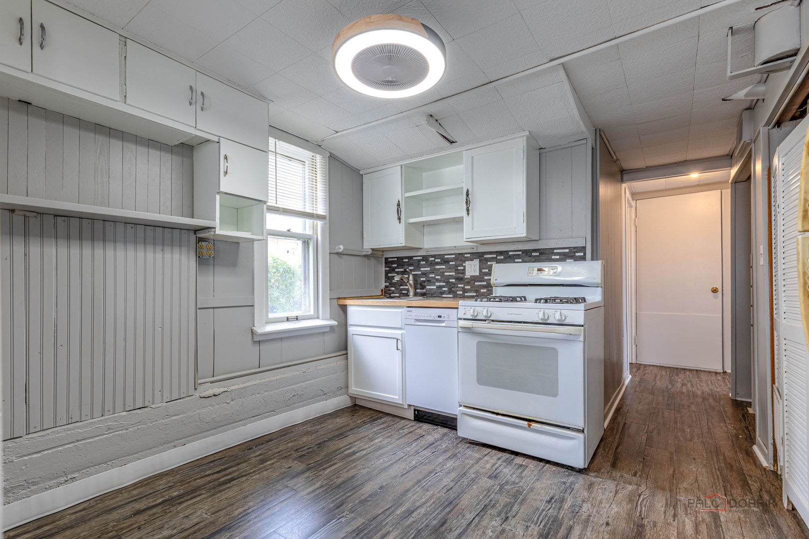 163 Eagle Point Road, Unit 1 Fox Lake, IL 60020 - Photo 14 of 26 a kitchen with stainless steel appliances granite countertop a stove a sink and a refrigerator