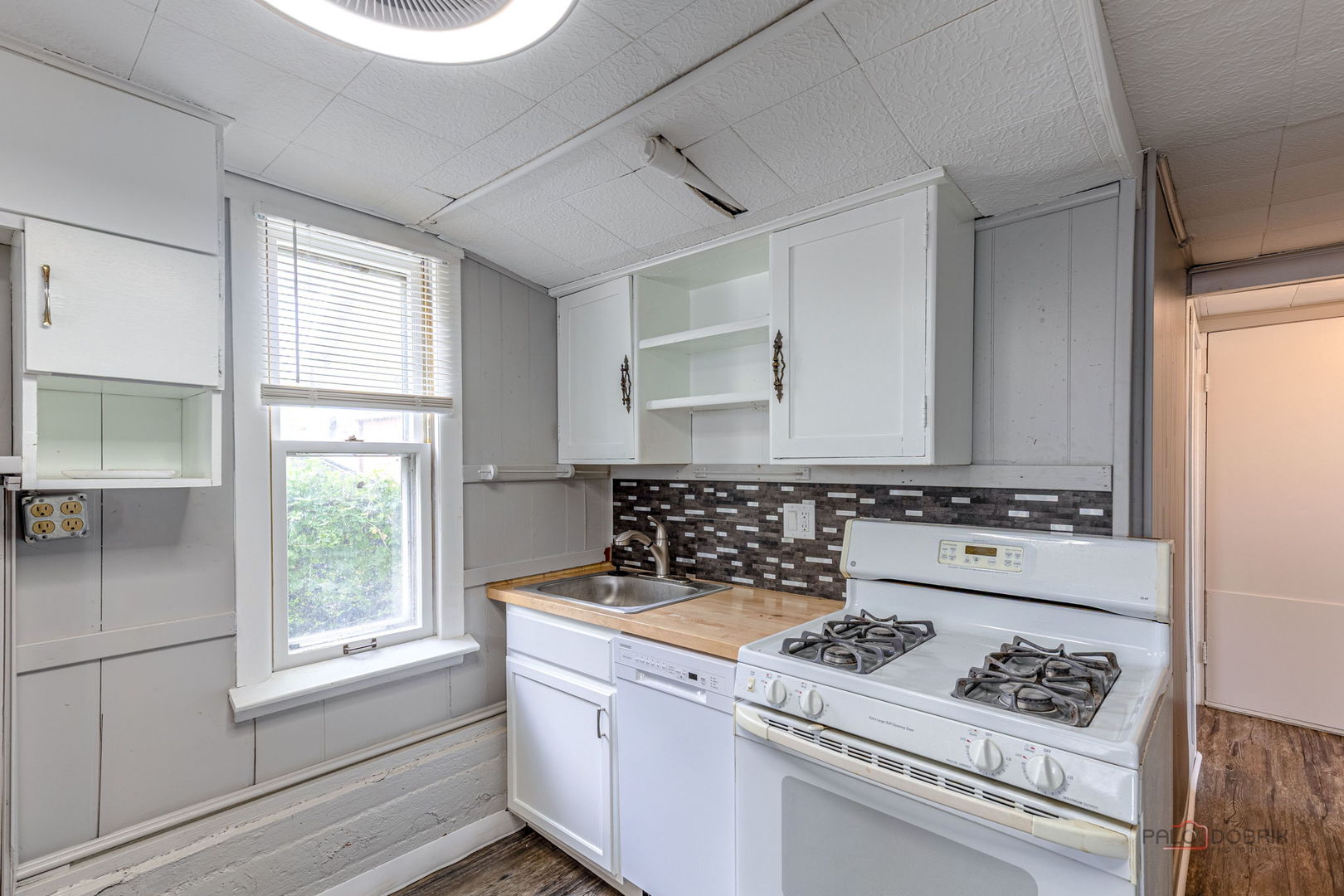 163 Eagle Point Road, Unit 1 Fox Lake, IL 60020 - Photo 16 of 26 a stove top oven sitting inside of a kitchen