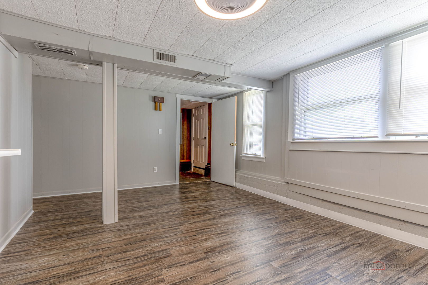163 Eagle Point Road, Unit 1 Fox Lake, IL 60020 - Photo 18 of 26 a view of an empty room with wooden floor and a window