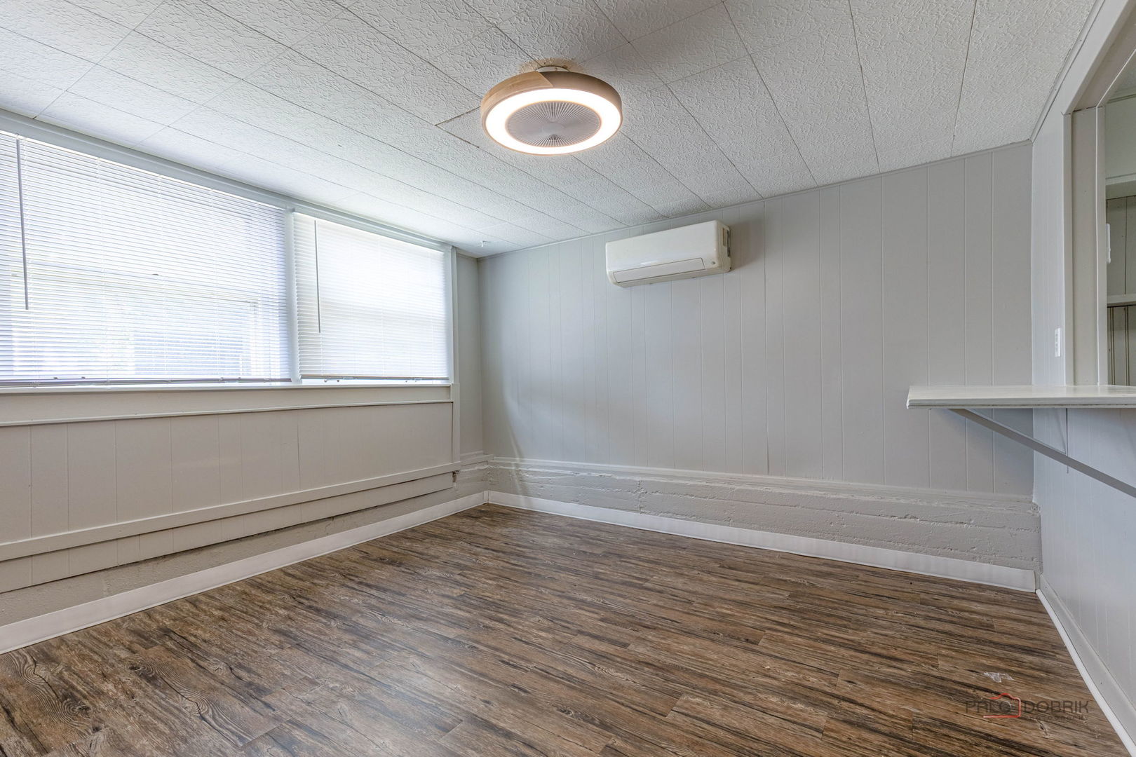 163 Eagle Point Road, Unit 1 Fox Lake, IL 60020 - Photo 20 of 26 a view of empty room with wooden floor and fan
