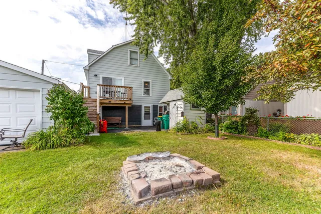 a view of a lake with houses in the back