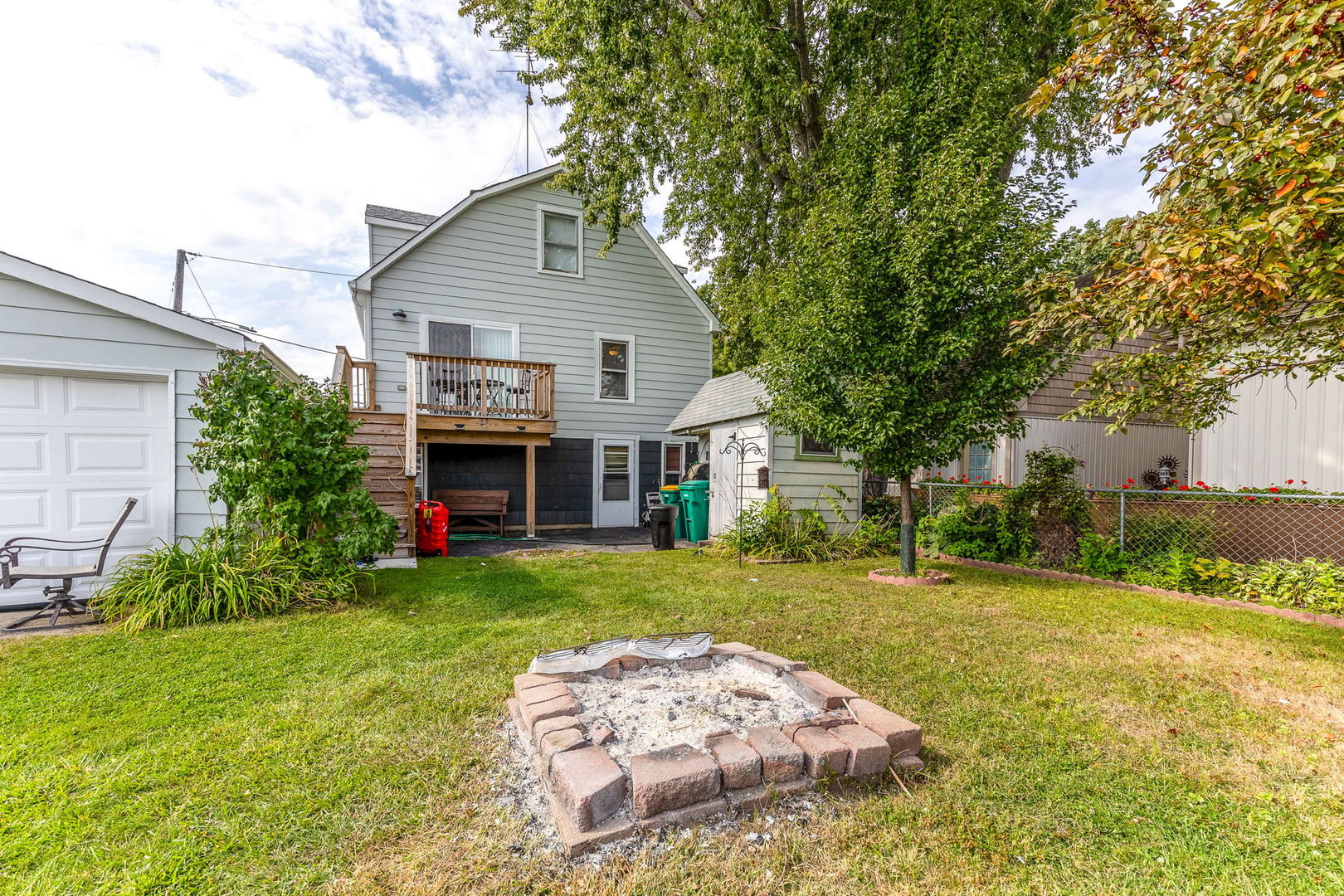 163 Eagle Point Road, Unit 1 Fox Lake, IL 60020 - Photo 22 of 26 a view of a house with a back yard