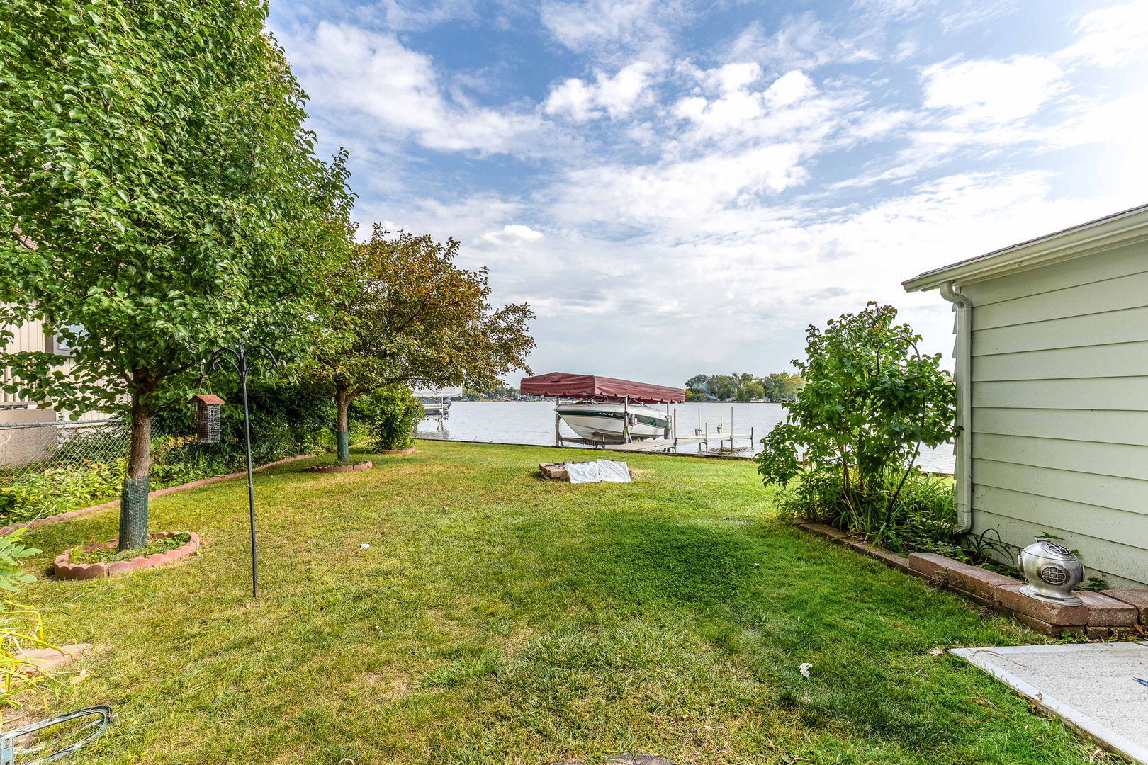 163 Eagle Point Road, Unit 1 Fox Lake, IL 60020 - Photo 25 of 26 a swimming pool with some trees in the background
