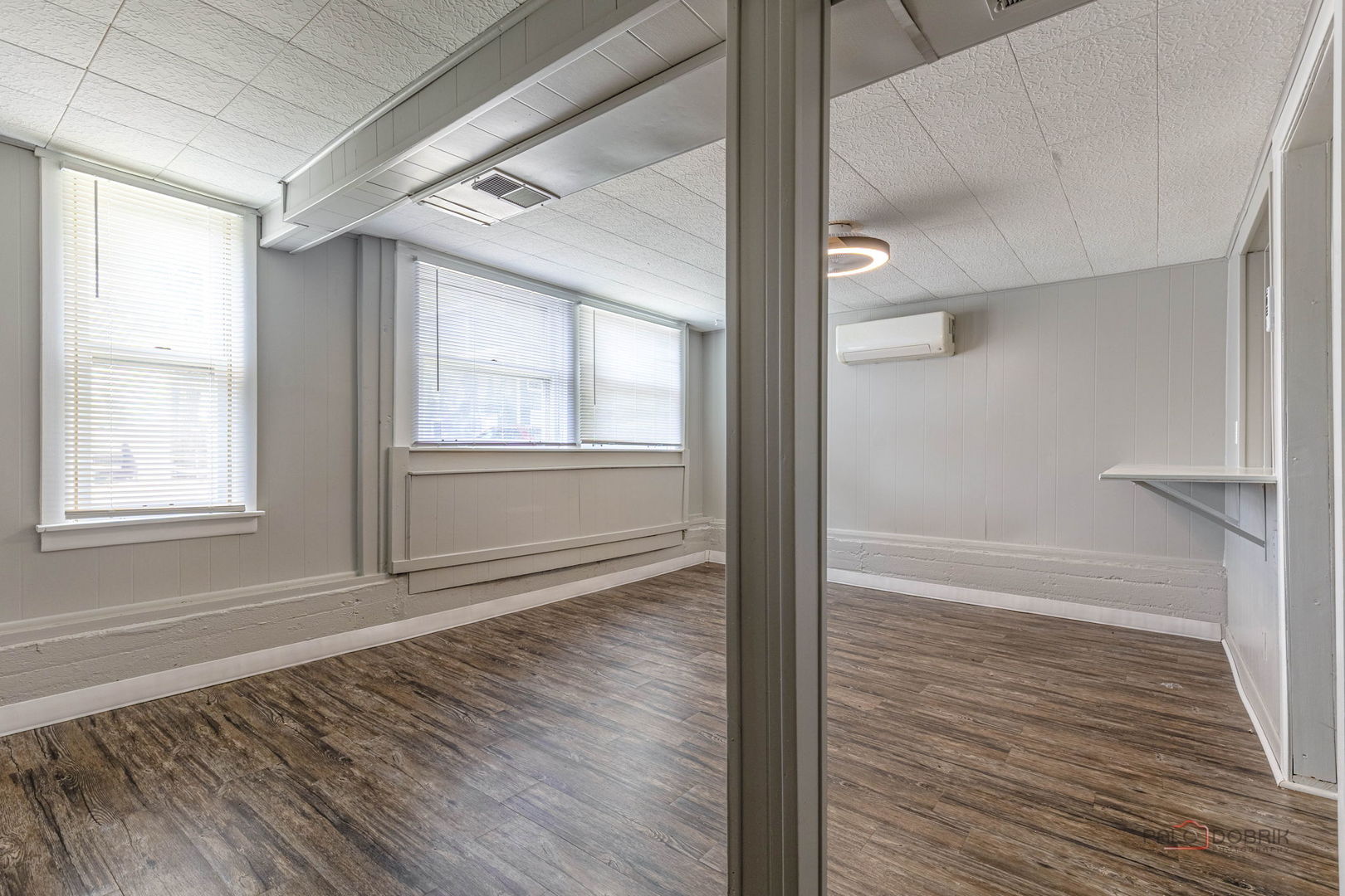 163 Eagle Point Road, Unit 1 Fox Lake, IL 60020 - Photo 9 of 26 a view of an empty room with wooden floor and a window