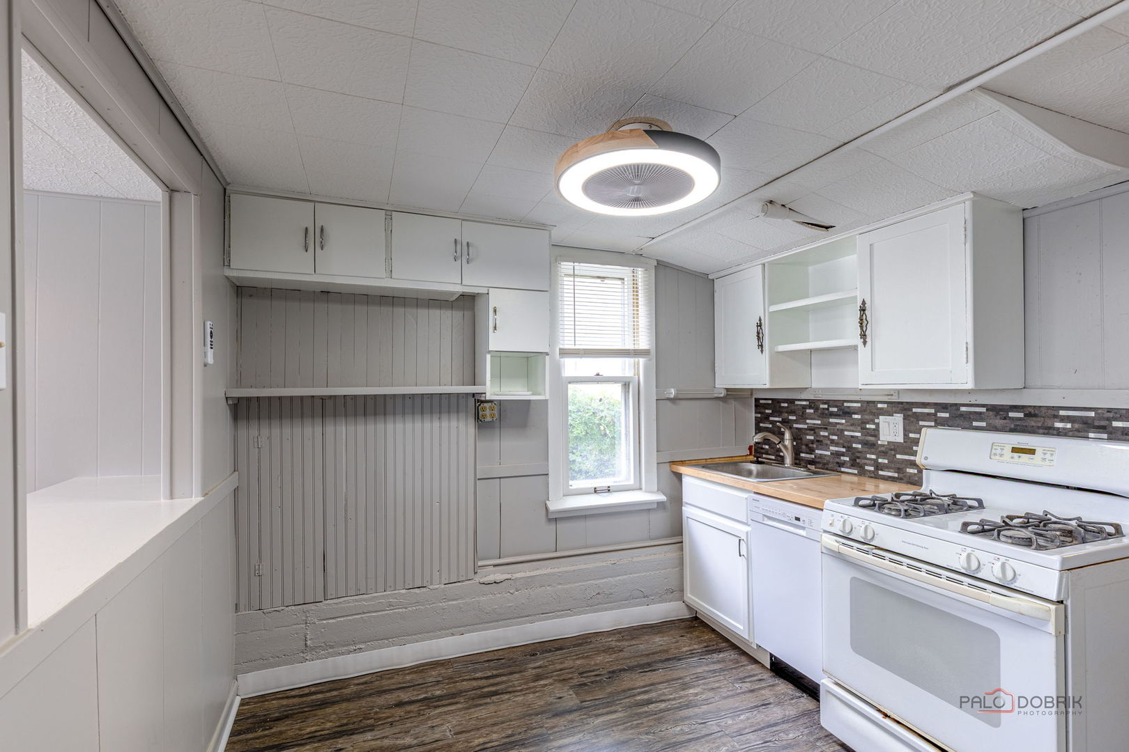 163 Eagle Point Road, Unit 1 Fox Lake, IL 60020 - Photo 10 of 26 a kitchen with a stove and a refrigerator