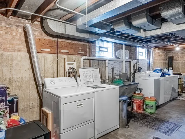 a view of a storage & utility room with washer and dryer