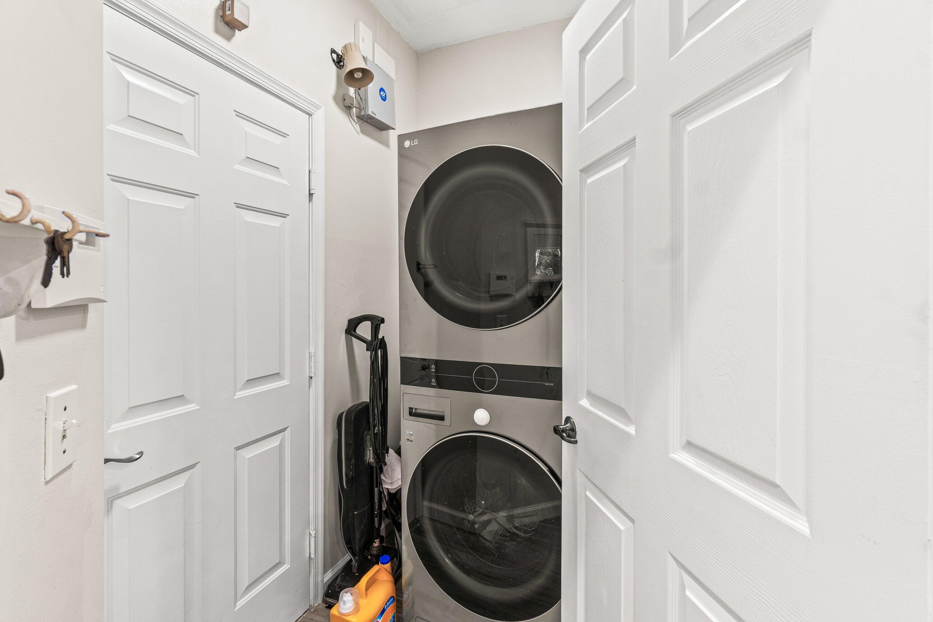 21256 Vía Fiore Boca Raton, FL 33433 - Photo 20 of 42 a utility room with dryer and washer