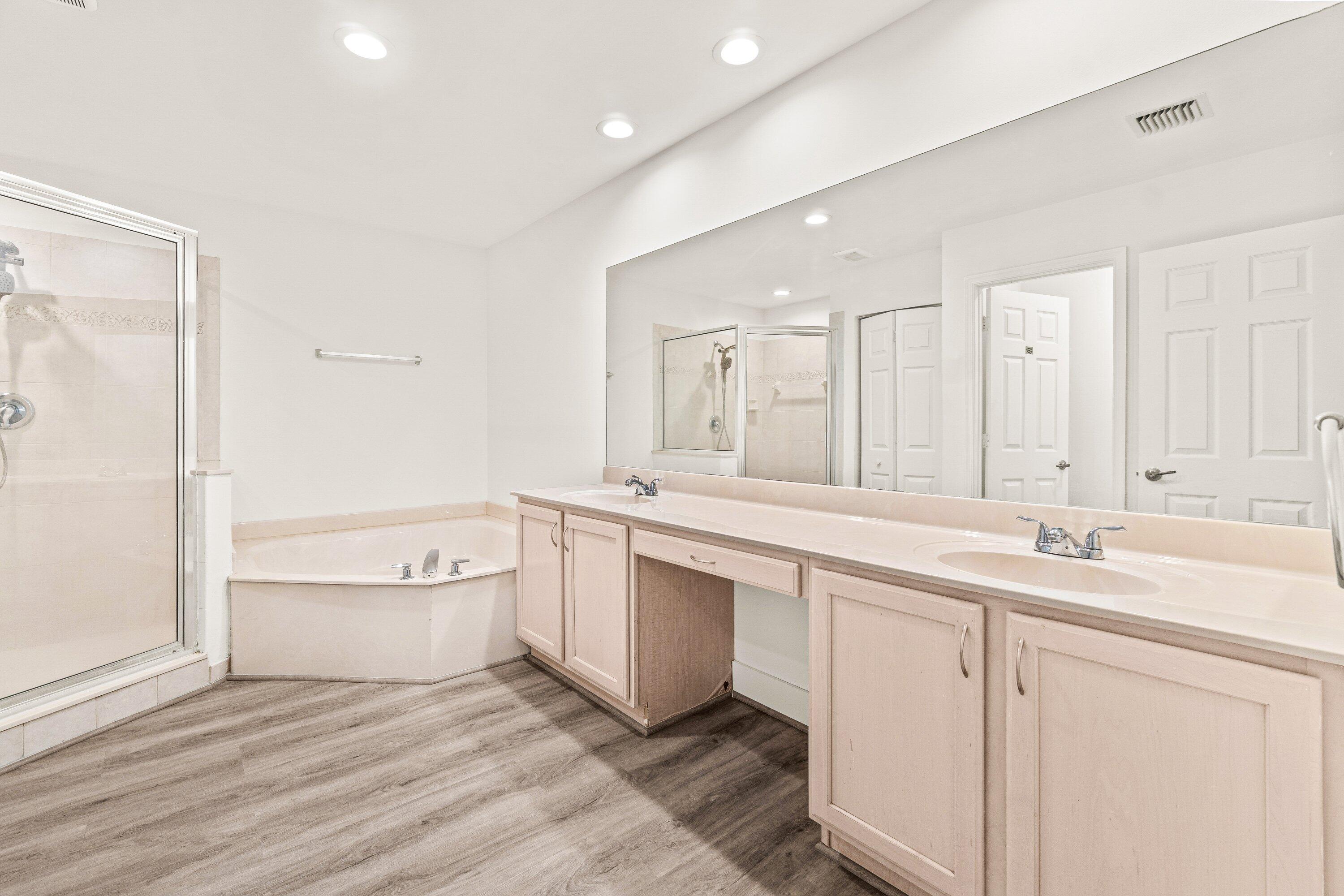 21256 Vía Fiore Boca Raton, FL 33433 - Photo 28 of 42 a bathroom with a sink a toilet and shower