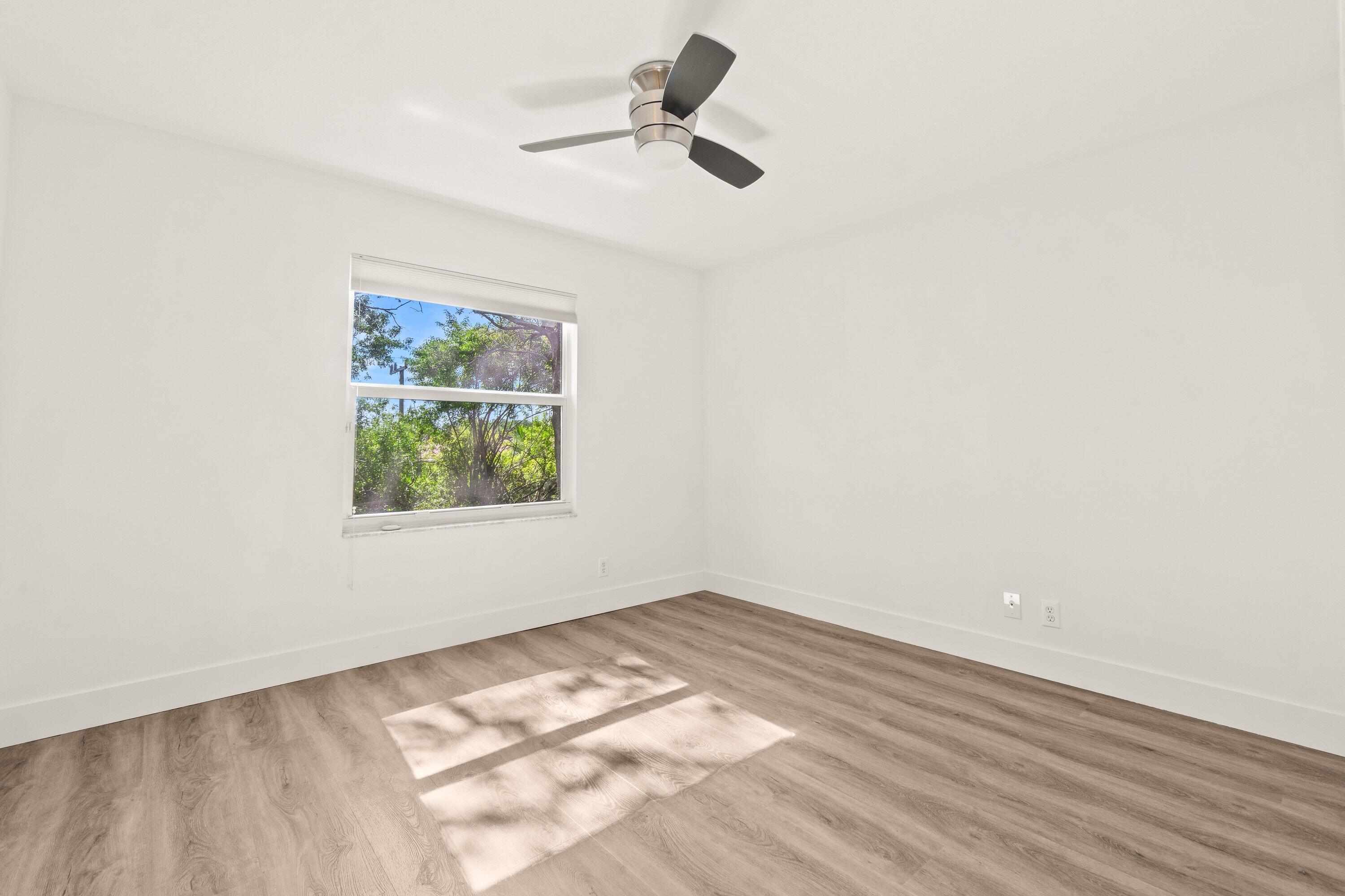 21256 Vía Fiore Boca Raton, FL 33433 - Photo 35 of 42 an empty room with a window