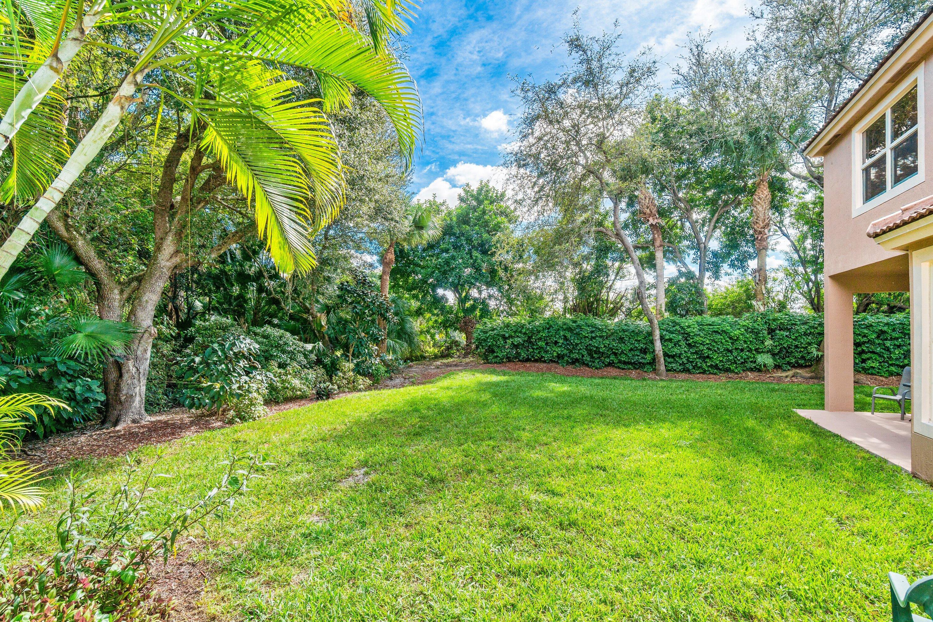 21256 Vía Fiore Boca Raton, FL 33433 - Photo 42 of 42 a view of a yard with plants and large trees
