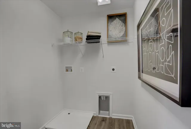 a kitchen with sink cabinets and wooden floor