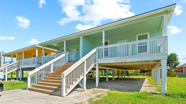 a view of house with swimming pool outdoor seating